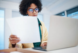 Woman reviewing invoice documents